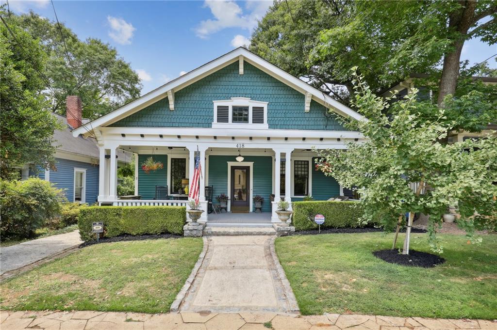 418 Sinclair Avenue Northeast Atlanta, GA 30307 - Photo 1 of 1 a front view of a house with a garden