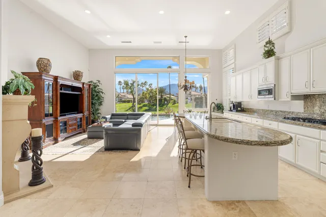 a living room with fireplace furniture and a flat screen tv