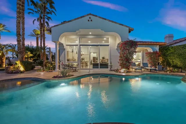 a view of a street with a houses in the background
