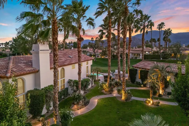 a view of a town with palm trees