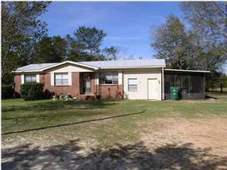 6172 Barnes Road Crestview, FL 32536 - Photo 1 of 8 a front view of a house with a yard