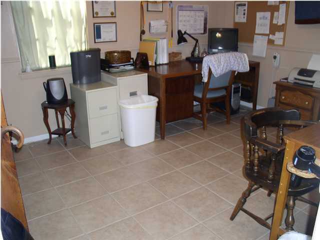 6172 Barnes Road Crestview, FL 32536 - Photo 6 of 8 a living room with furniture a piano and a window