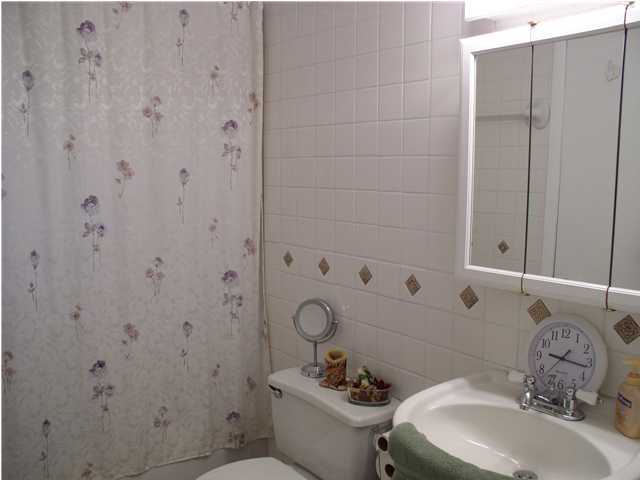 6172 Barnes Road Crestview, FL 32536 - Photo 7 of 8 a bathroom with a sink a toilet and shower