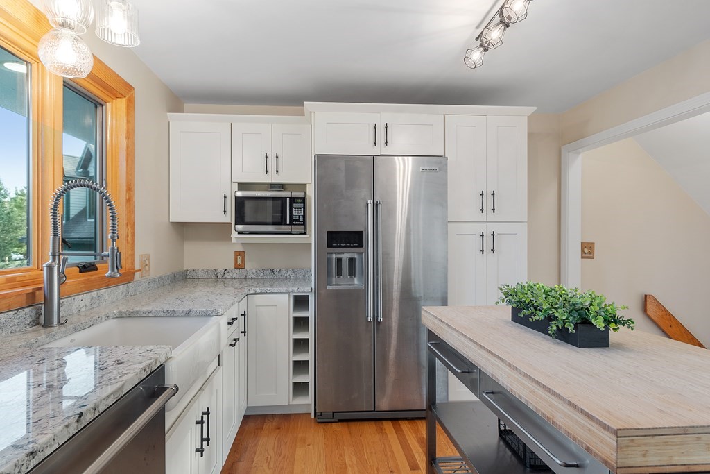 36 Osgood Road Sterling, MA 01564 - Photo 13 of 40 a kitchen with granite countertop a refrigerator stove and sink