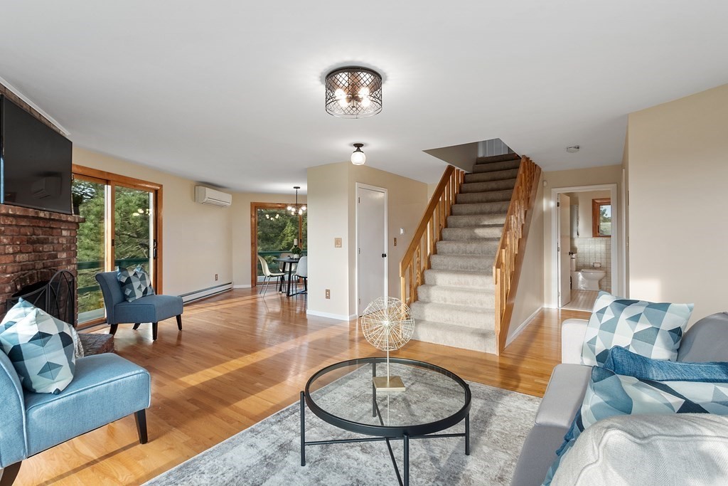 36 Osgood Road Sterling, MA 01564 - Photo 18 of 40 a living room with furniture and a chandelier