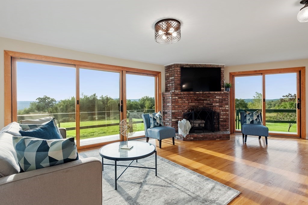 36 Osgood Road Sterling, MA 01564 - Photo 20 of 40 a living room with fireplace furniture and a flat screen tv