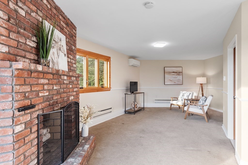 36 Osgood Road Sterling, MA 01564 - Photo 3 of 40 a living room with fireplace furniture and a window
