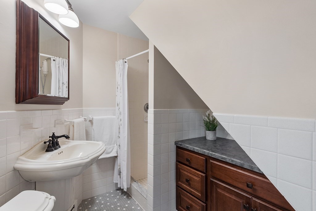 36 Osgood Road Sterling, MA 01564 - Photo 5 of 40 a bathroom with a toilet sink and mirror