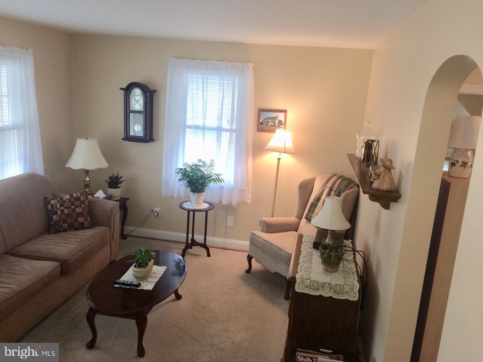 1248 June Road Baltimore, MD 21227 - Photo 4 of 18 a living room with furniture and a wooden floor