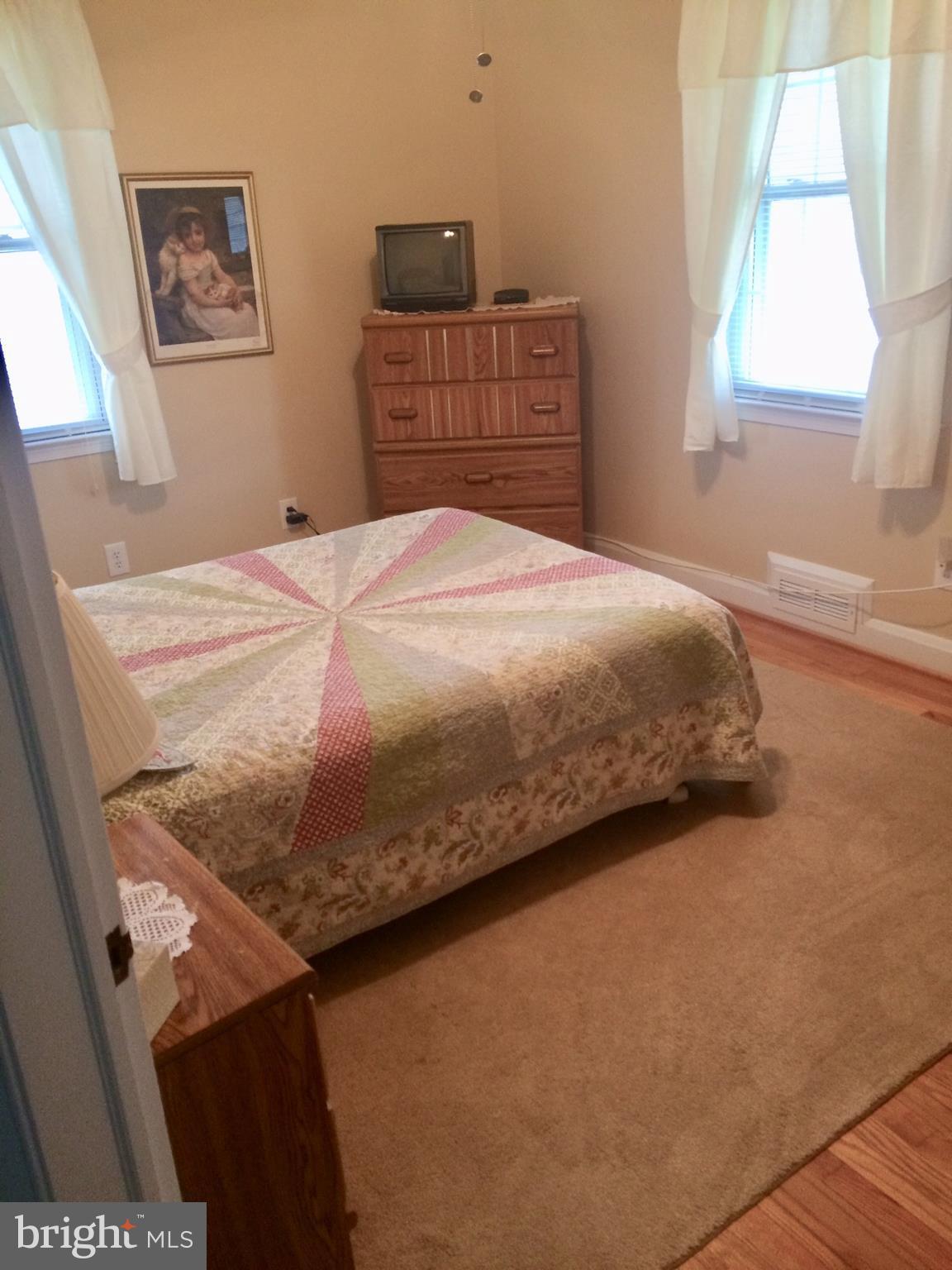 1248 June Road Baltimore, MD 21227 - Photo 8 of 18 a bedroom with a bed and a window