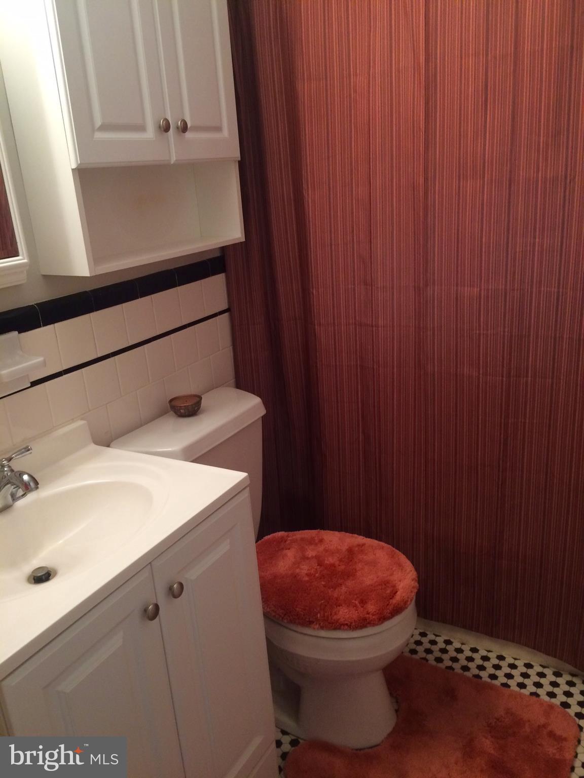 1248 June Road Baltimore, MD 21227 - Photo 9 of 18 a bathroom with a sink toilet and vanity