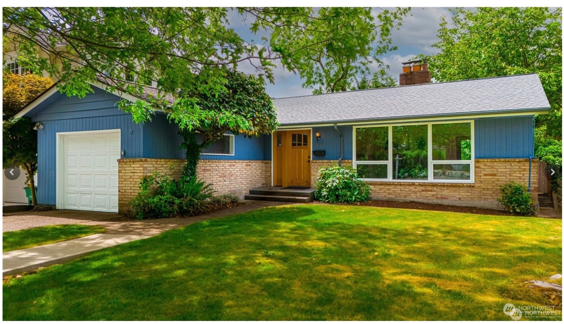 7551 45th Avenue Northeast Seattle, WA 98115 - Photo 1 of 1 a view of a house with garden and yard