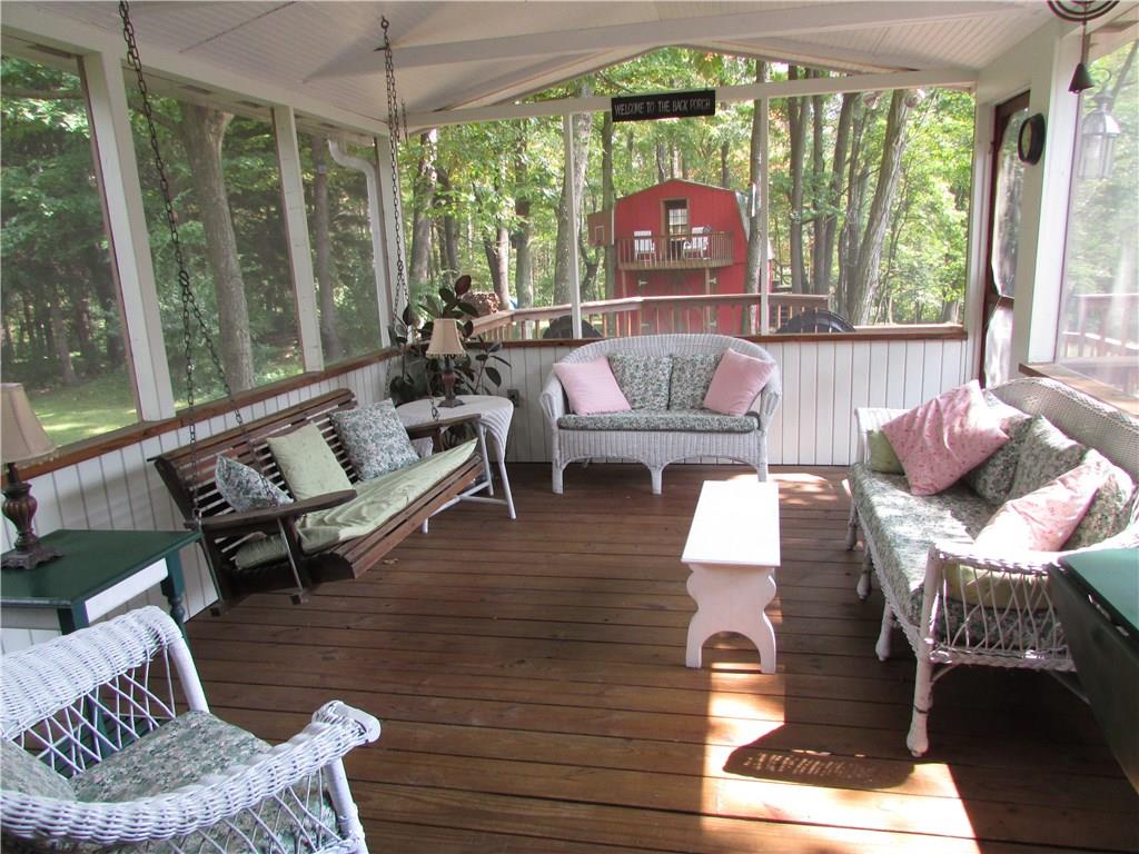136 McKenzie Road Clinton, PA 15026 - Photo 3 of 25 Screened in porch with walkout to deck and sliding doors into the home.