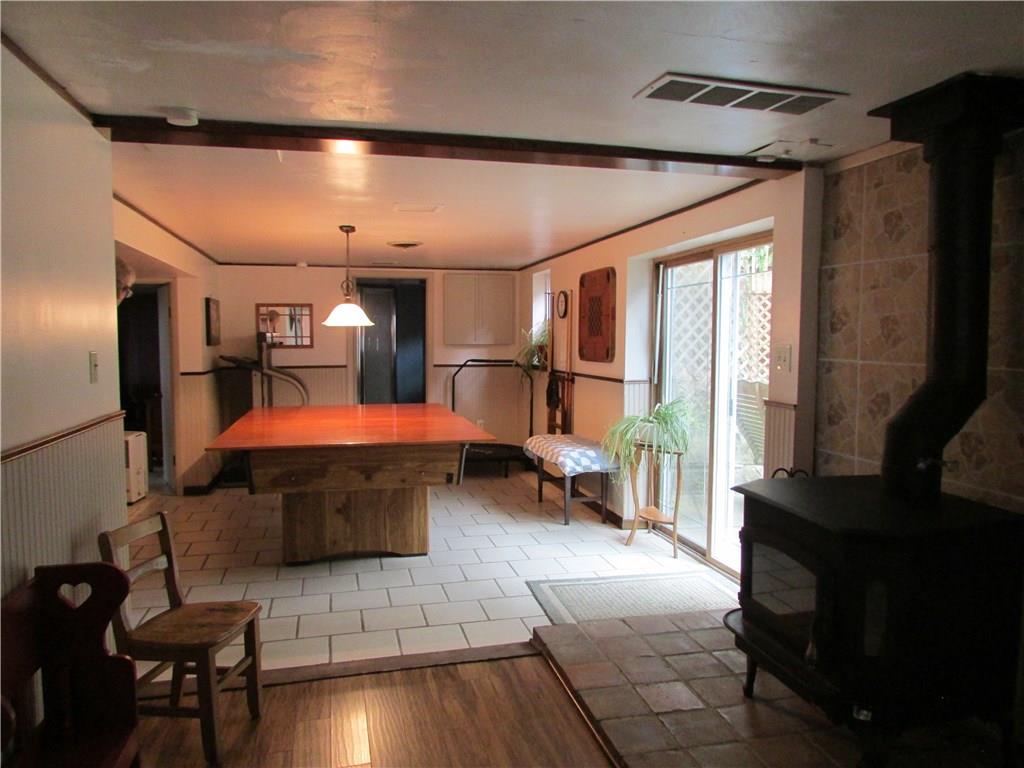 136 McKenzie Road Clinton, PA 15026 - Photo 21 of 25 Gameroom in lower level with walkout out to rear yard.