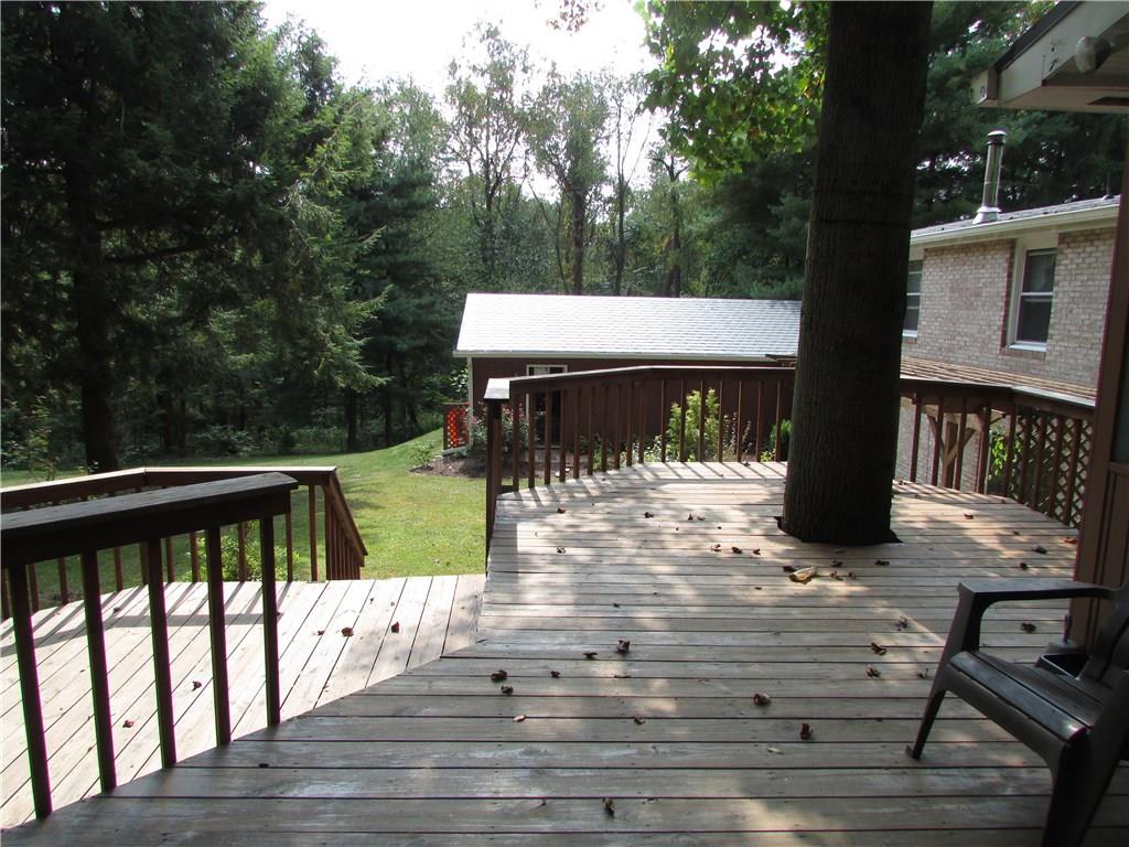 136 McKenzie Road Clinton, PA 15026 - Photo 4 of 25 Rear tiered deck from sunroom.