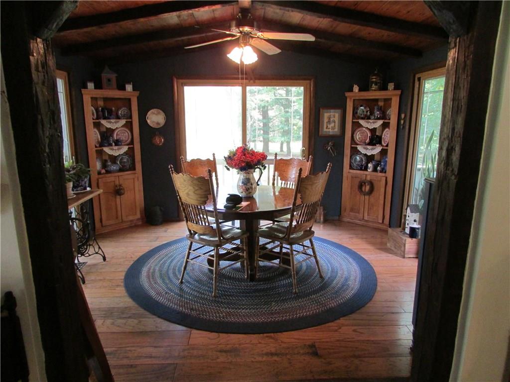136 McKenzie Road Clinton, PA 15026 - Photo 9 of 25 Dining room with 3 sets of sliding doors and wood ceiling.
