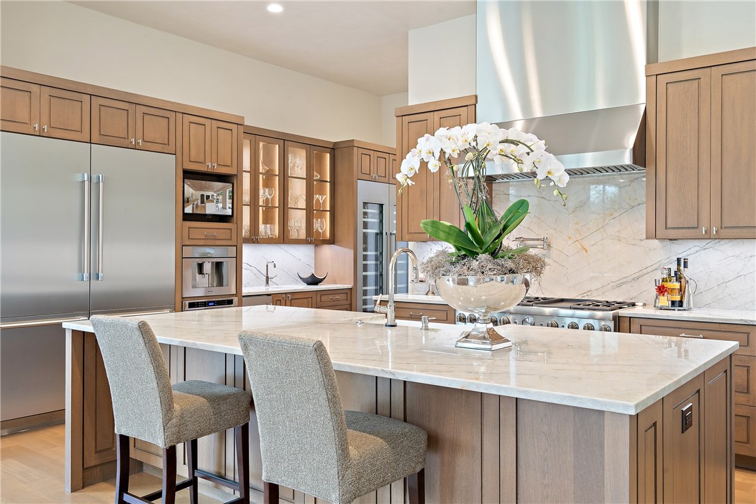 a kitchen with a table and chairs in it