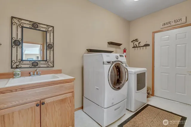 a utility room with dryer and washer