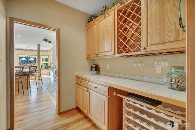 a kitchen with stainless steel appliances granite countertop a sink and cabinets
