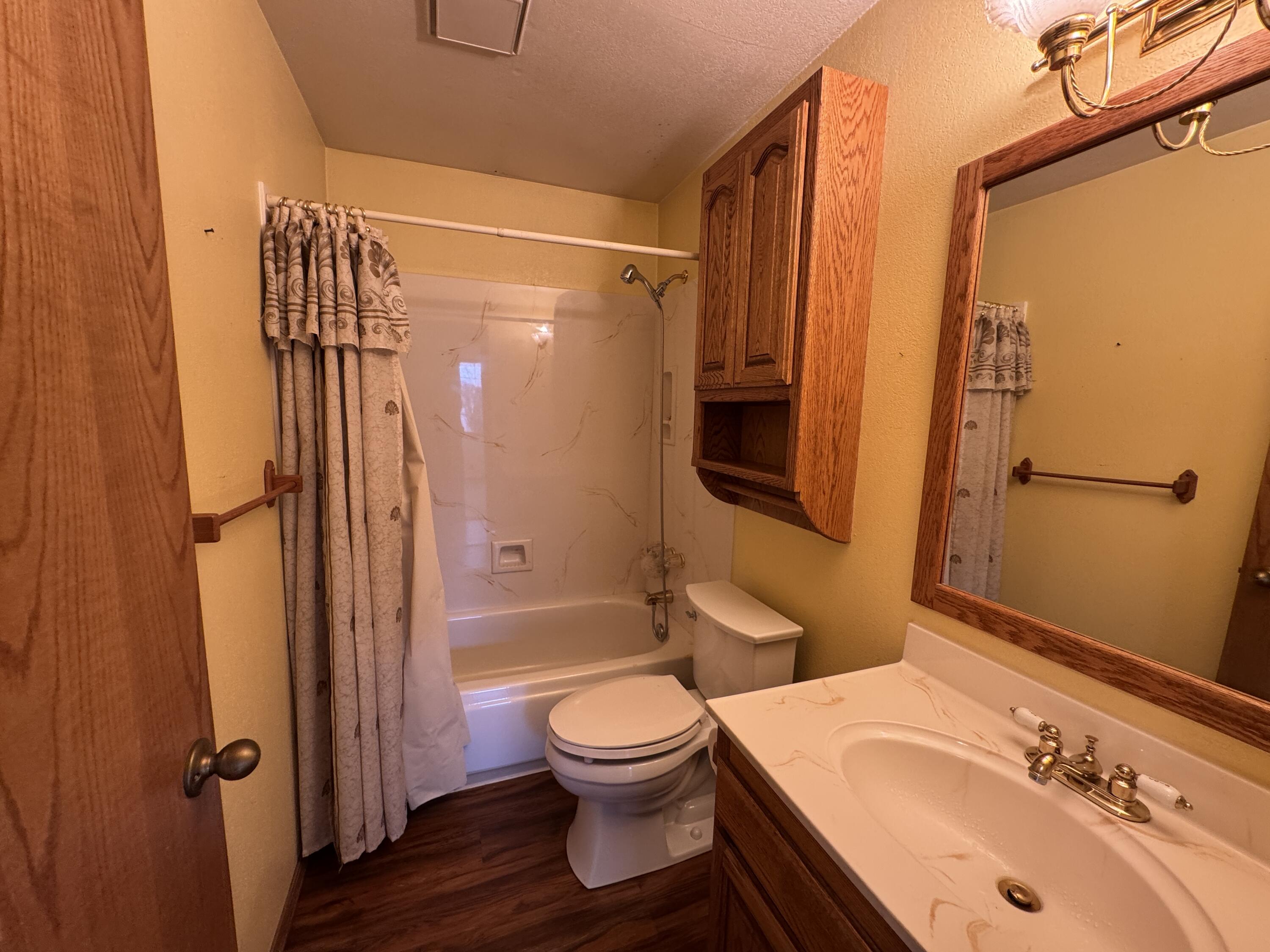 20525 Hudson Street Burney, CA 96013 - Photo 30 of 58 a bathroom with a sink toilet tub and shower