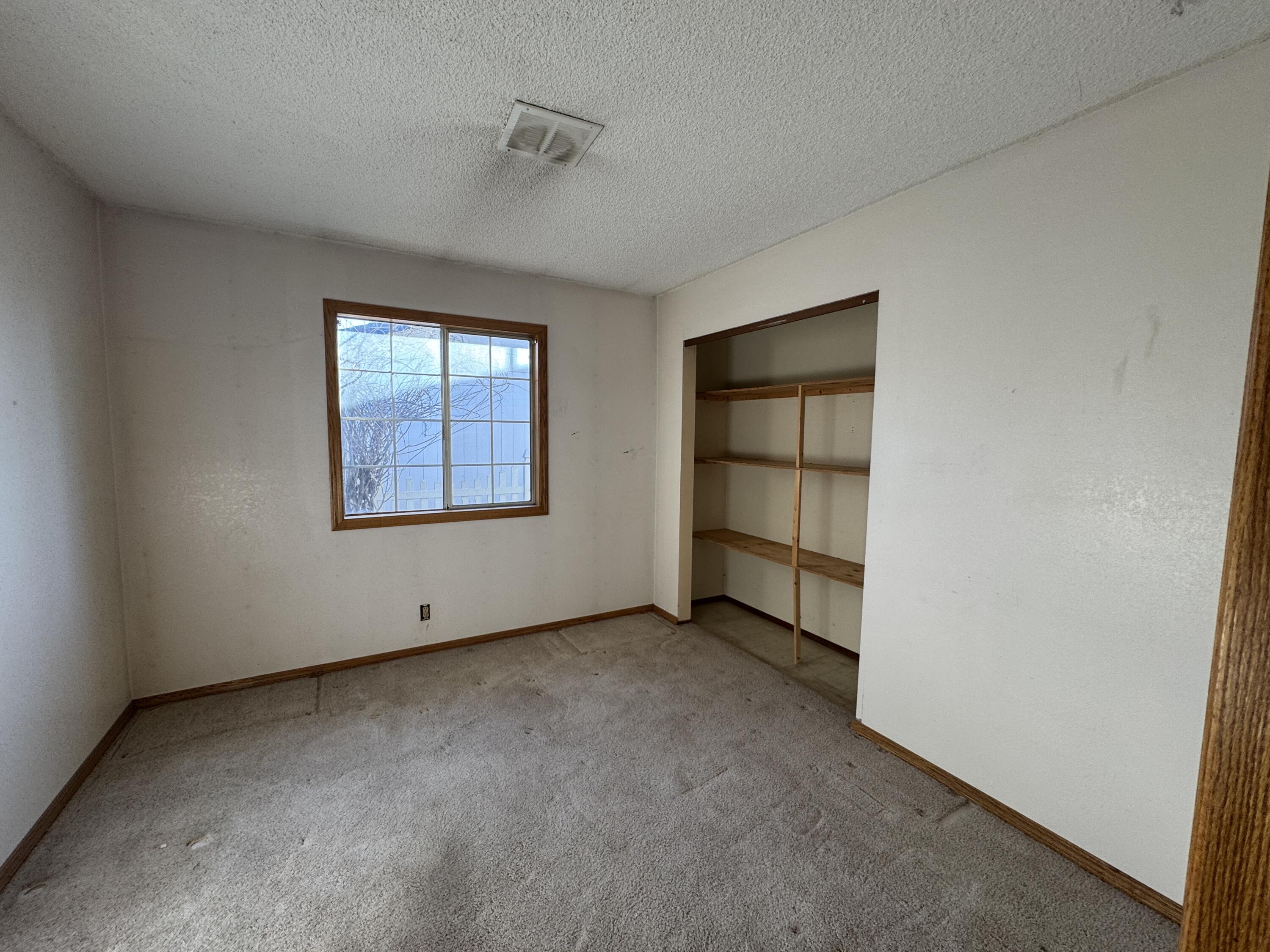 20525 Hudson Street Burney, CA 96013 - Photo 32 of 58 an empty room with a empty space and windows