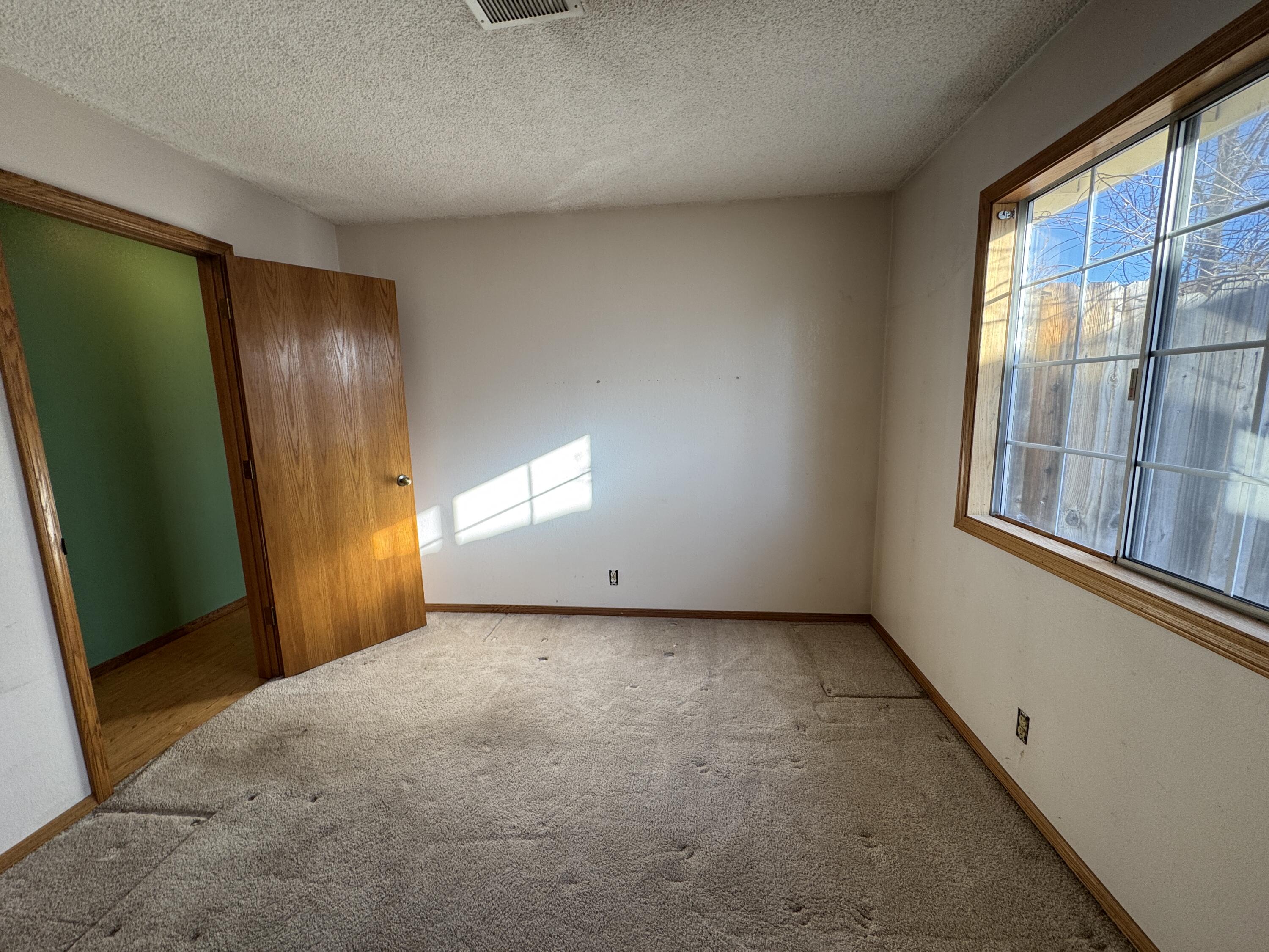 20525 Hudson Street Burney, CA 96013 - Photo 33 of 58 wooden floor in an empty room with a window