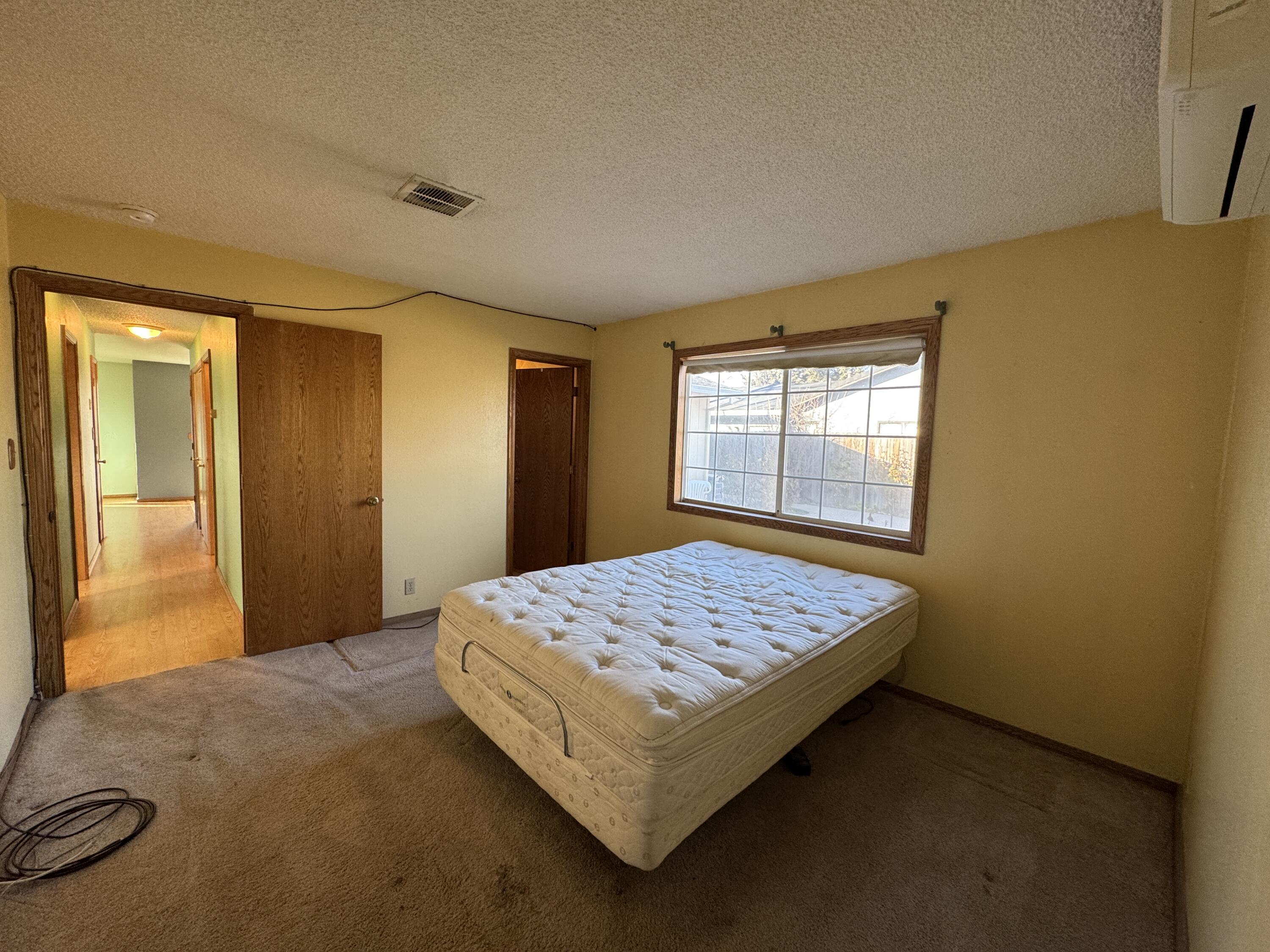 20525 Hudson Street Burney, CA 96013 - Photo 38 of 58 a bedroom with a bed and a window