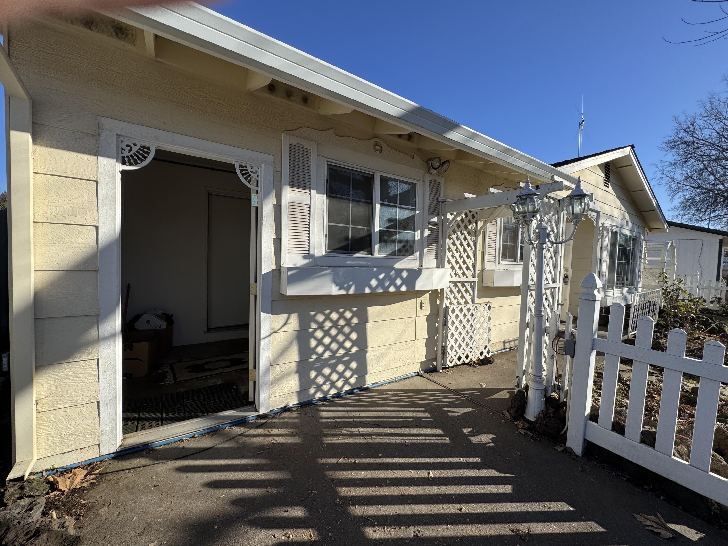 20525 Hudson Street Burney, CA 96013 - Photo 45 of 58 a front view of a house with a yard