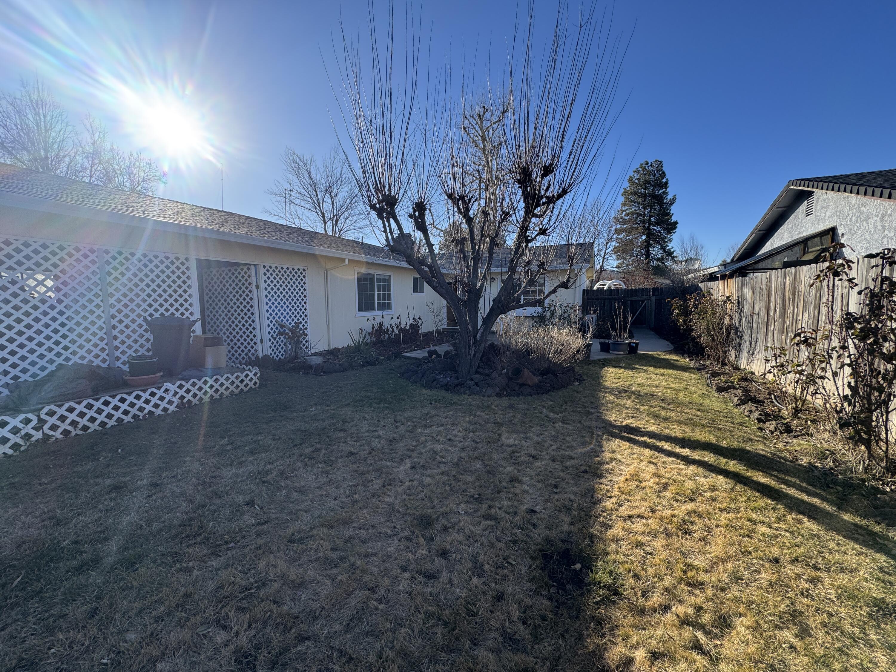 20525 Hudson Street Burney, CA 96013 - Photo 49 of 58 a view of a yard with wooden fence