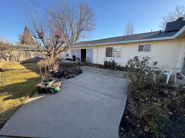 a view of a room with furniture and a window