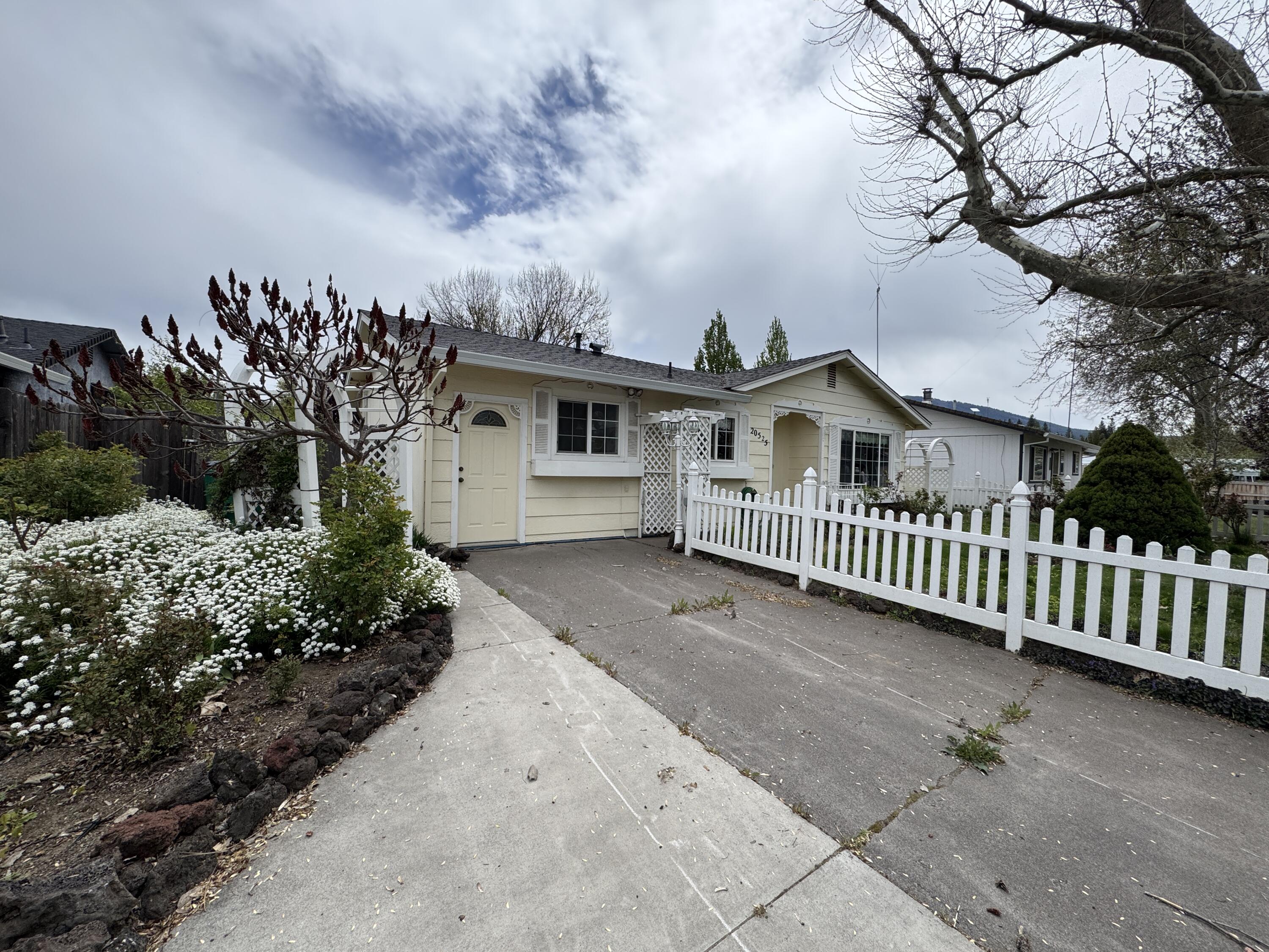 20525 Hudson Street Burney, CA 96013 - Photo 57 of 58 a view of a house with a yard and potted plants