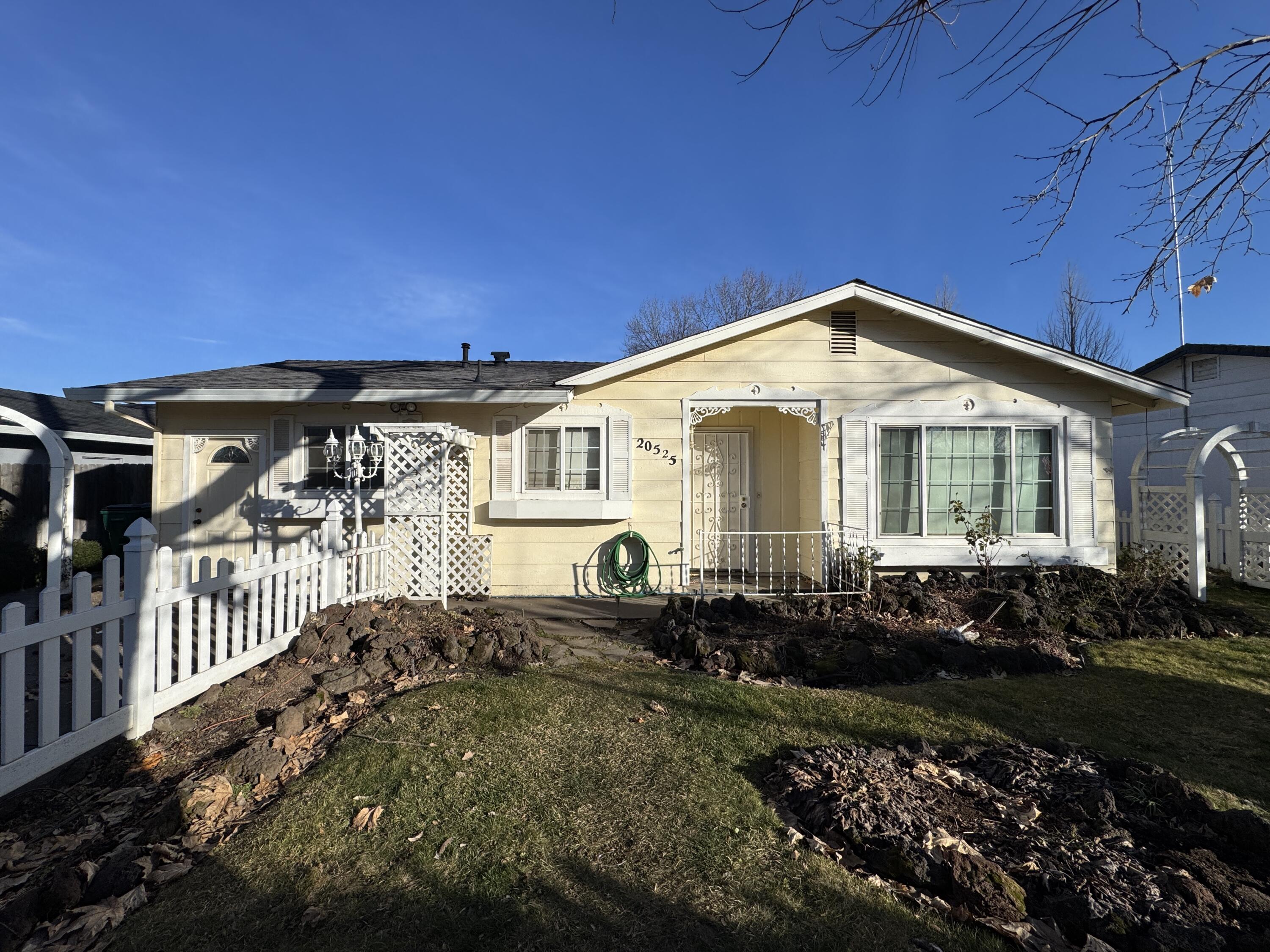 20525 Hudson Street Burney, CA 96013 - Photo 6 of 58 a front view of a house with a yard