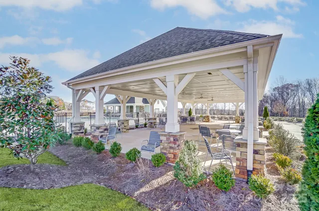 a view of multiple houses with a yard