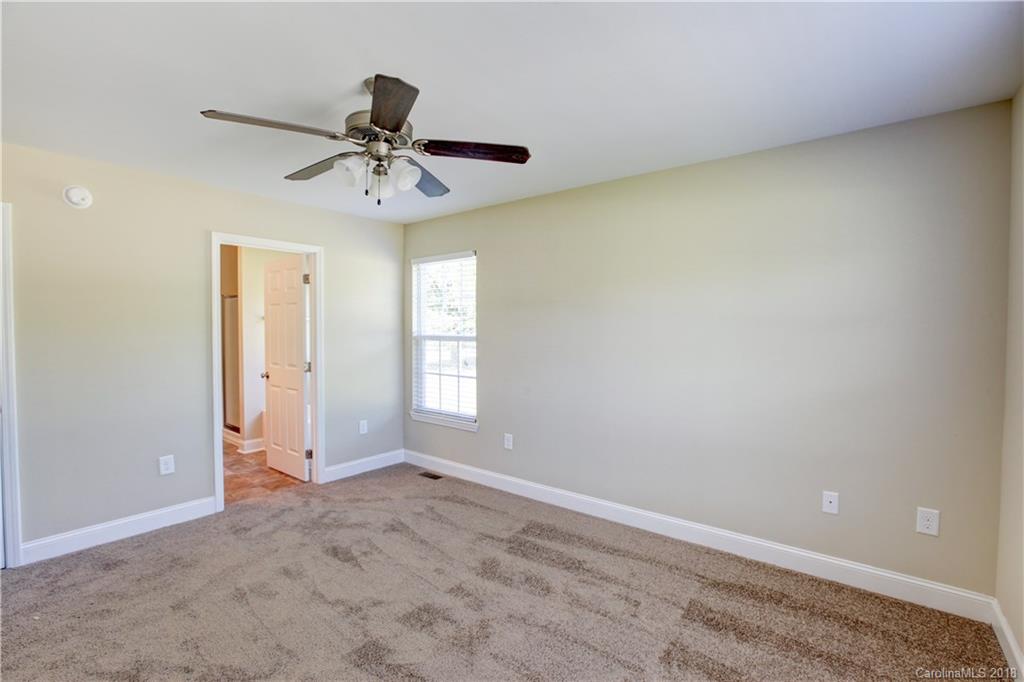 3713 Austin Road Monroe, NC 28112 - Photo 13 of 19 an empty room with windows and fan