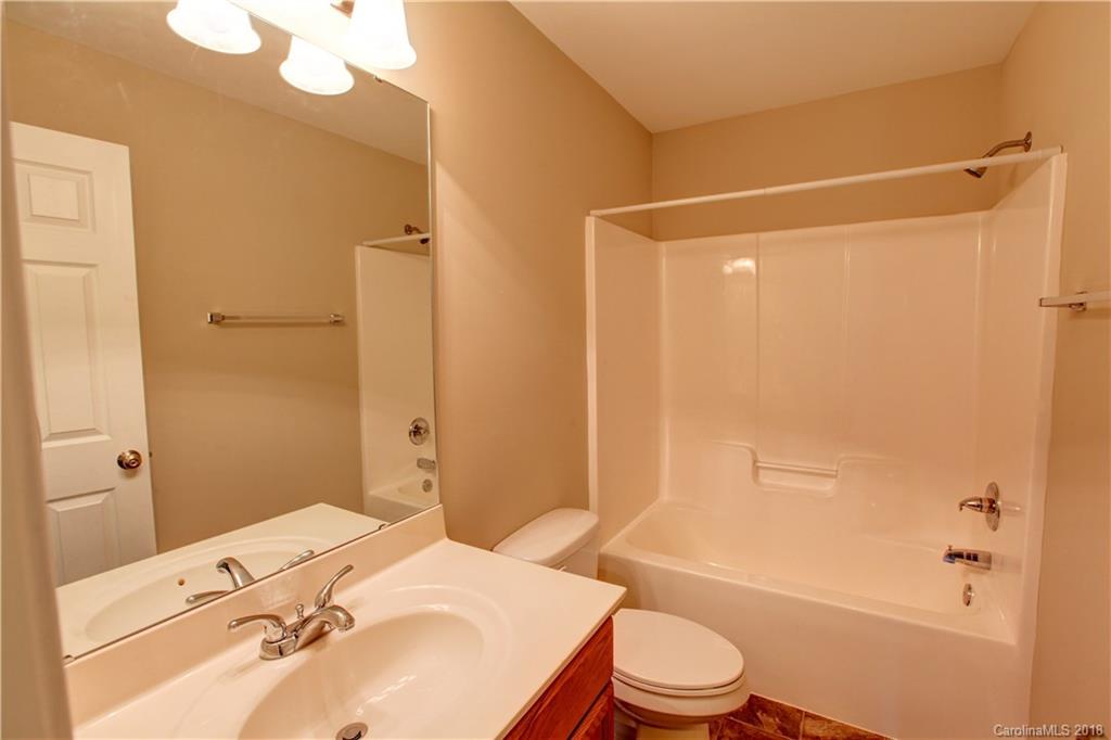 3713 Austin Road Monroe, NC 28112 - Photo 17 of 19 a bathroom with a sink toilet and shower