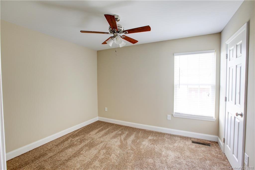 3713 Austin Road Monroe, NC 28112 - Photo 19 of 19 a view of a big room with wooden floor closet and windows