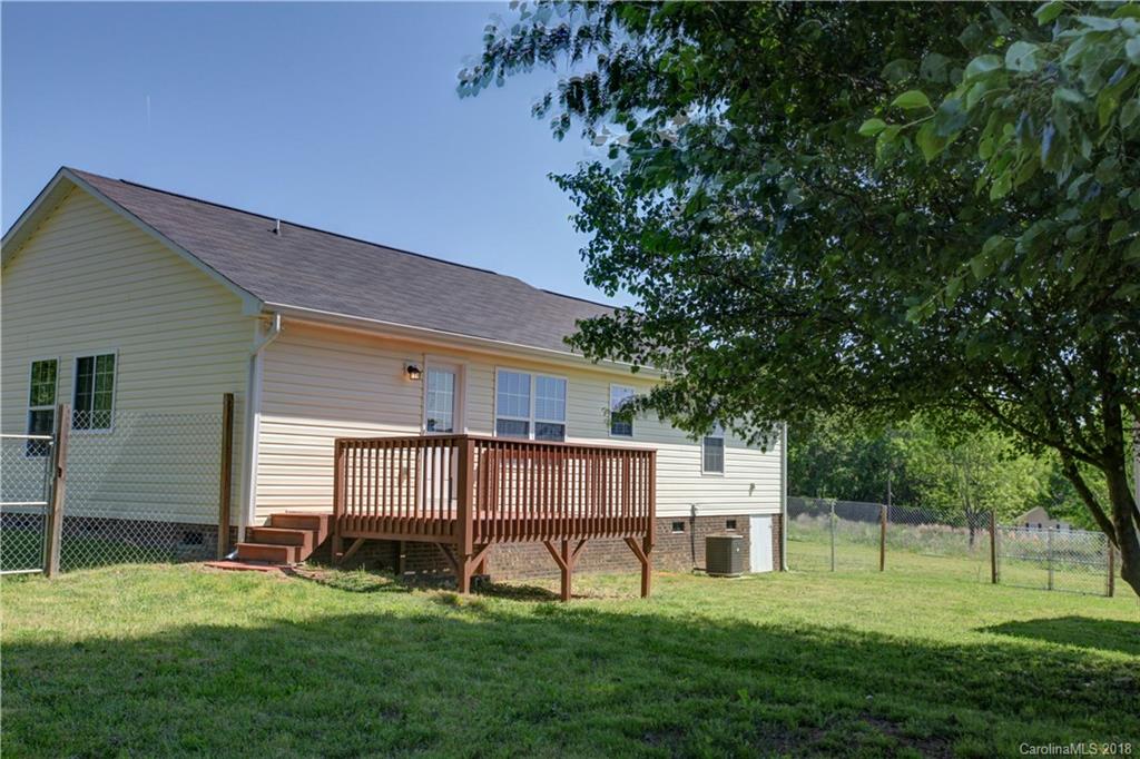 3713 Austin Road Monroe, NC 28112 - Photo 4 of 19 a view of a backyard with a garden and deck