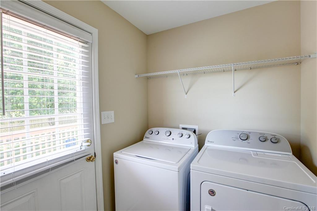 3713 Austin Road Monroe, NC 28112 - Photo 7 of 19 a view of storage and utility room with washer and dryer