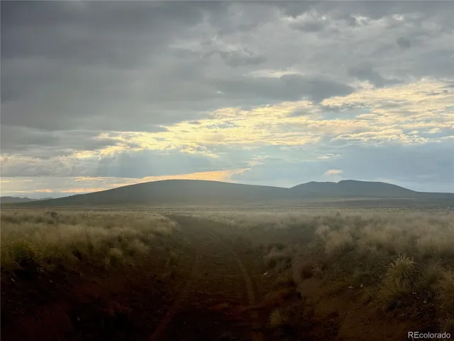 a view of an ocean and mountain