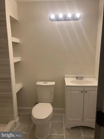 a bathroom with a toilet and a sink