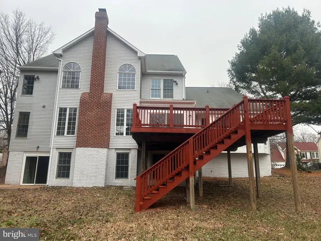 a view of a house with a balcony and stairs