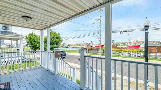 a view of a porch with wooden floor