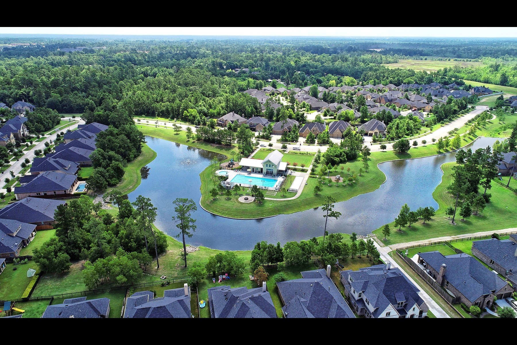 1010 Bat Hawk Court Conroe, TX 77385 - Photo 48 of 50 an aerial view of house with yard swimming pool and outdoor seating