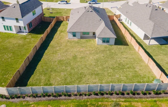 a view of swimming pool with outdoor seating and yard