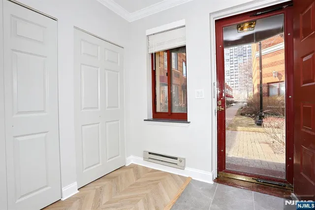 a kitchen with stainless steel appliances a stove a sink and a refrigerator
