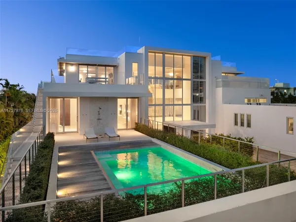 a front view of a house with swimming pool