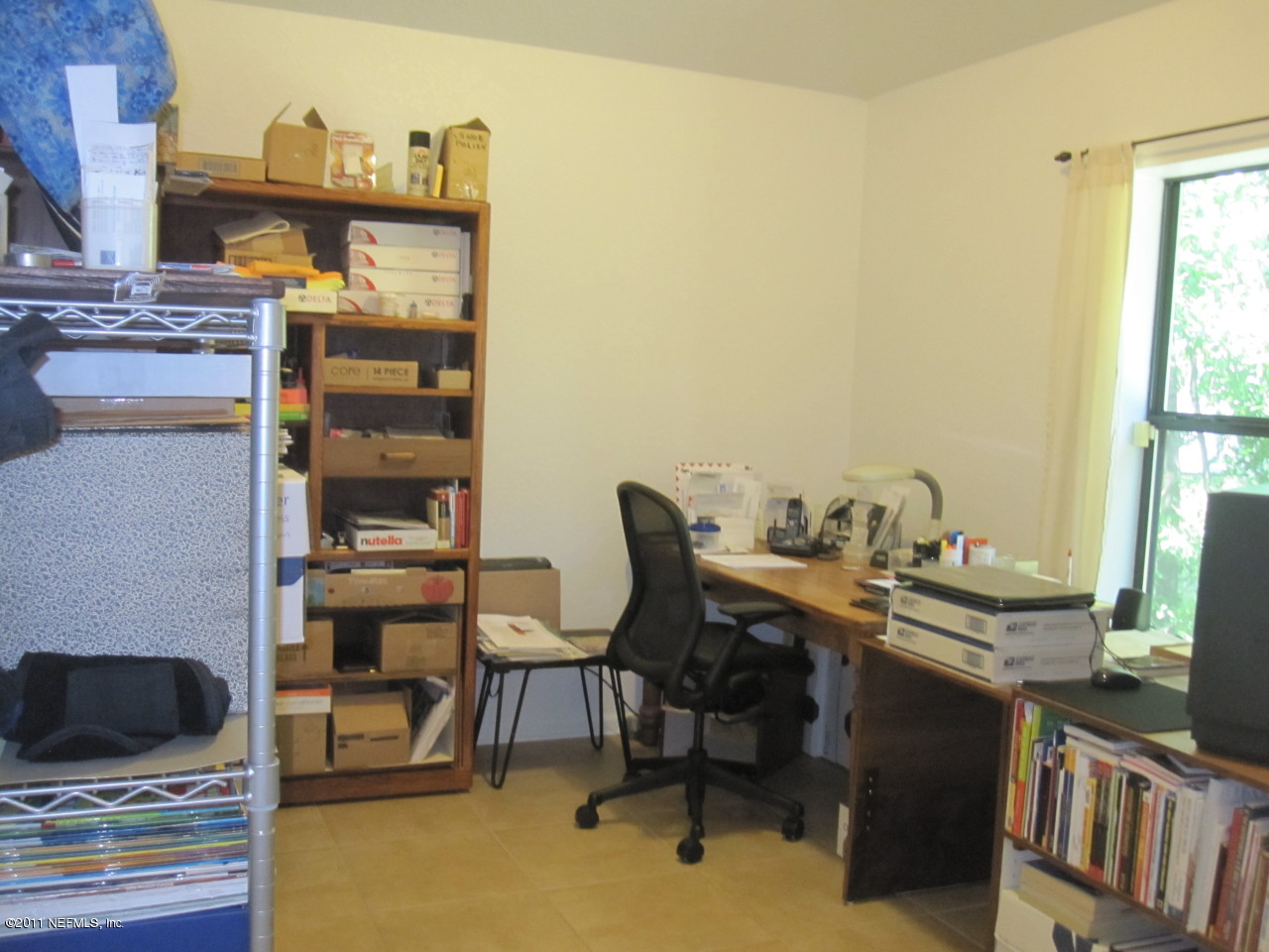 12589 Knotah Road Jacksonville, FL 32258 - Photo 14 of 25 a view of a workspace with furniture and a window