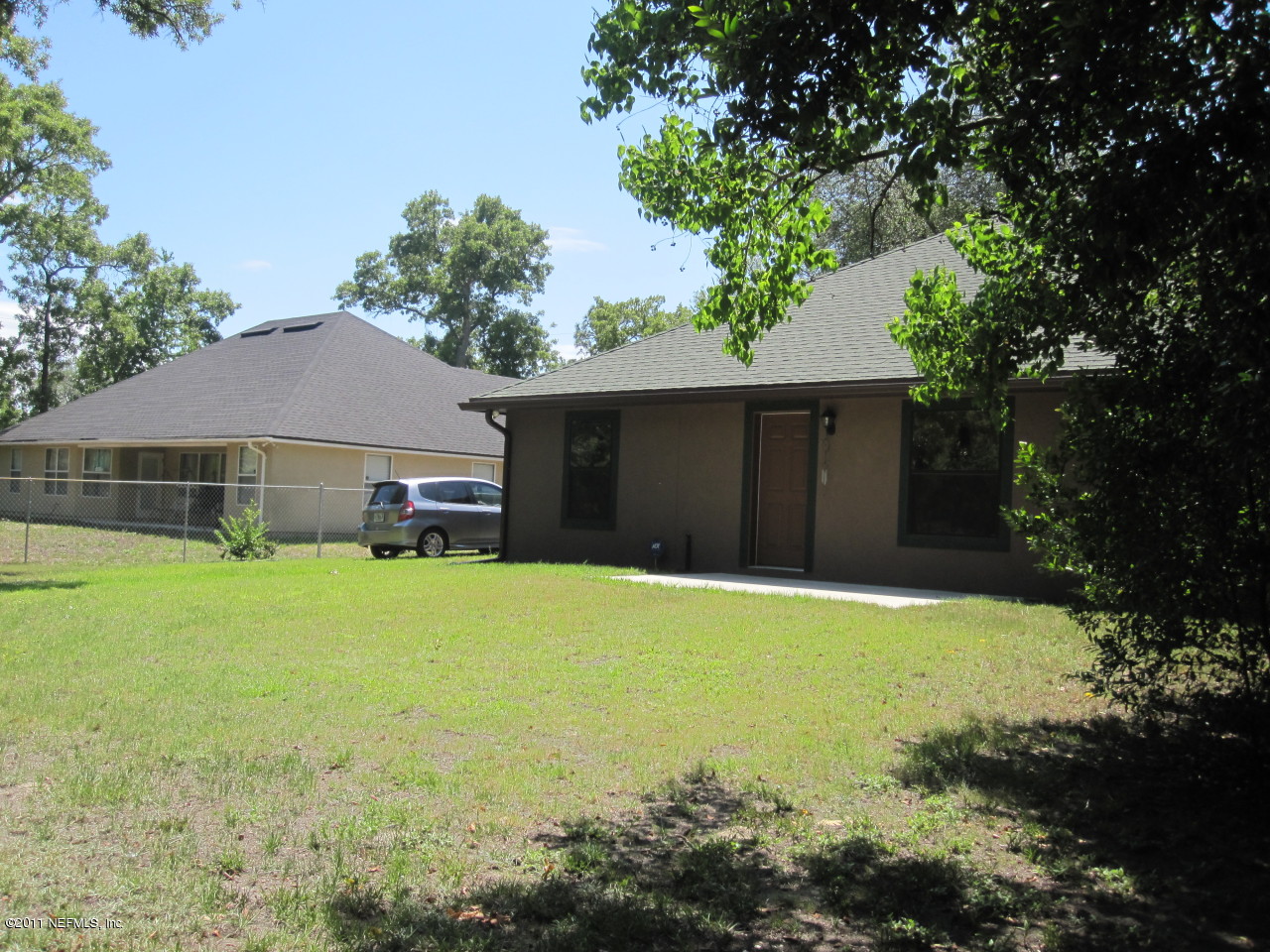 12589 Knotah Road Jacksonville, FL 32258 - Photo 16 of 25 a front view of house with yard and trees