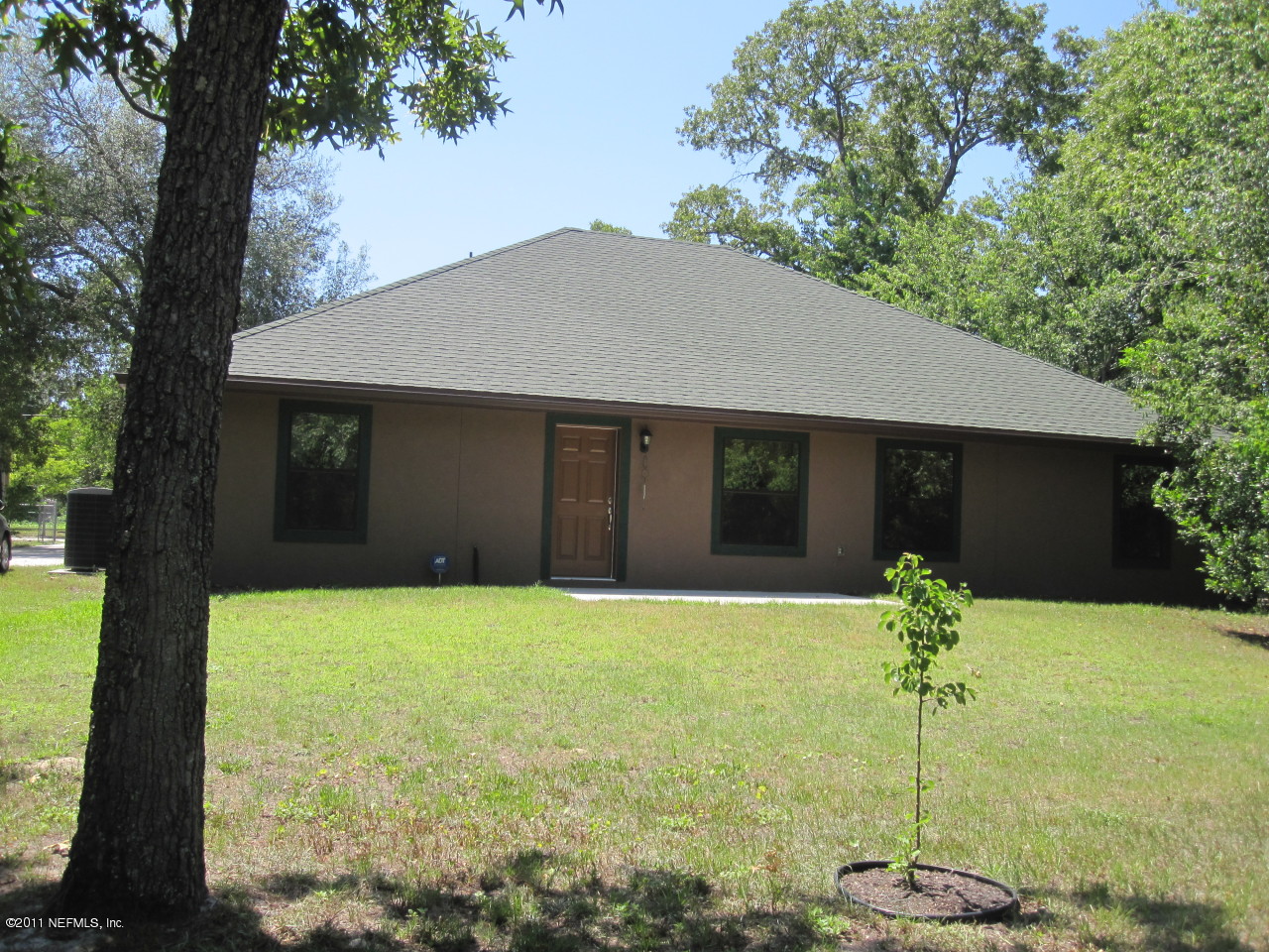 12589 Knotah Road Jacksonville, FL 32258 - Photo 18 of 25 a house that has a tree in it