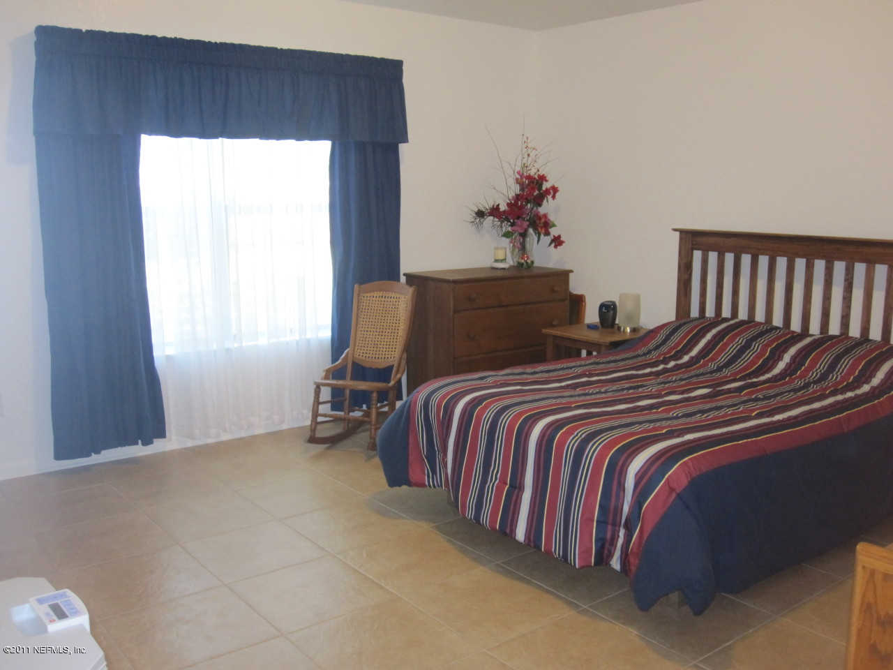 12589 Knotah Road Jacksonville, FL 32258 - Photo 4 of 25 a bedroom with a bed and window
